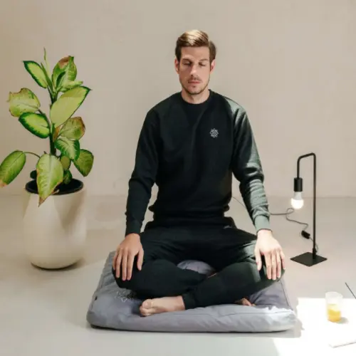 A large rectangular Mindful & Modern Zabuton Meditation Mat in a serene setting, featuring a soft, cotton-filled design, perfect for kneeling or sitting during yoga and meditation practices.